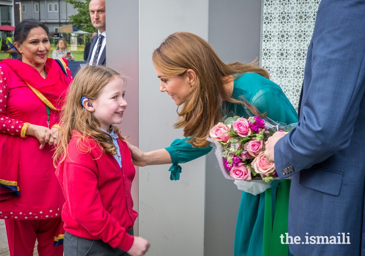 The Duchess of Cambridge shares a moment with a student from the Kings Cross Academy.