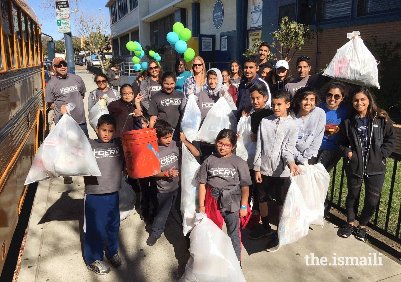 I-CERV volunteers show off the trash collected on their clean-up run around the neighborhood.