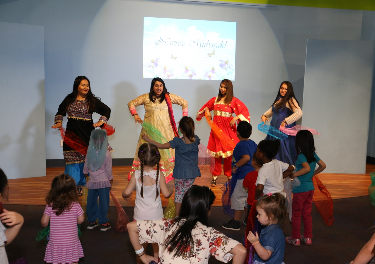 Ismaili volunteers, Farishta Saba, Zohra Nayani, Farheen Hasham and Amber Kaisani  lead a traditional Pamiri dance with silk scarves.