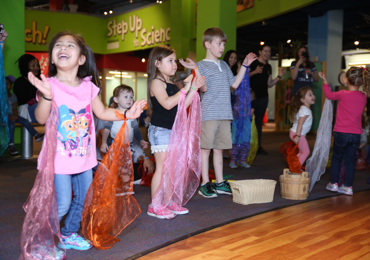 Children dancing and singing to seasonal and traditional Navroz spring songs at the Meet the Holidays series, an initiative focused on developing an appreciation of diversity in young children.
