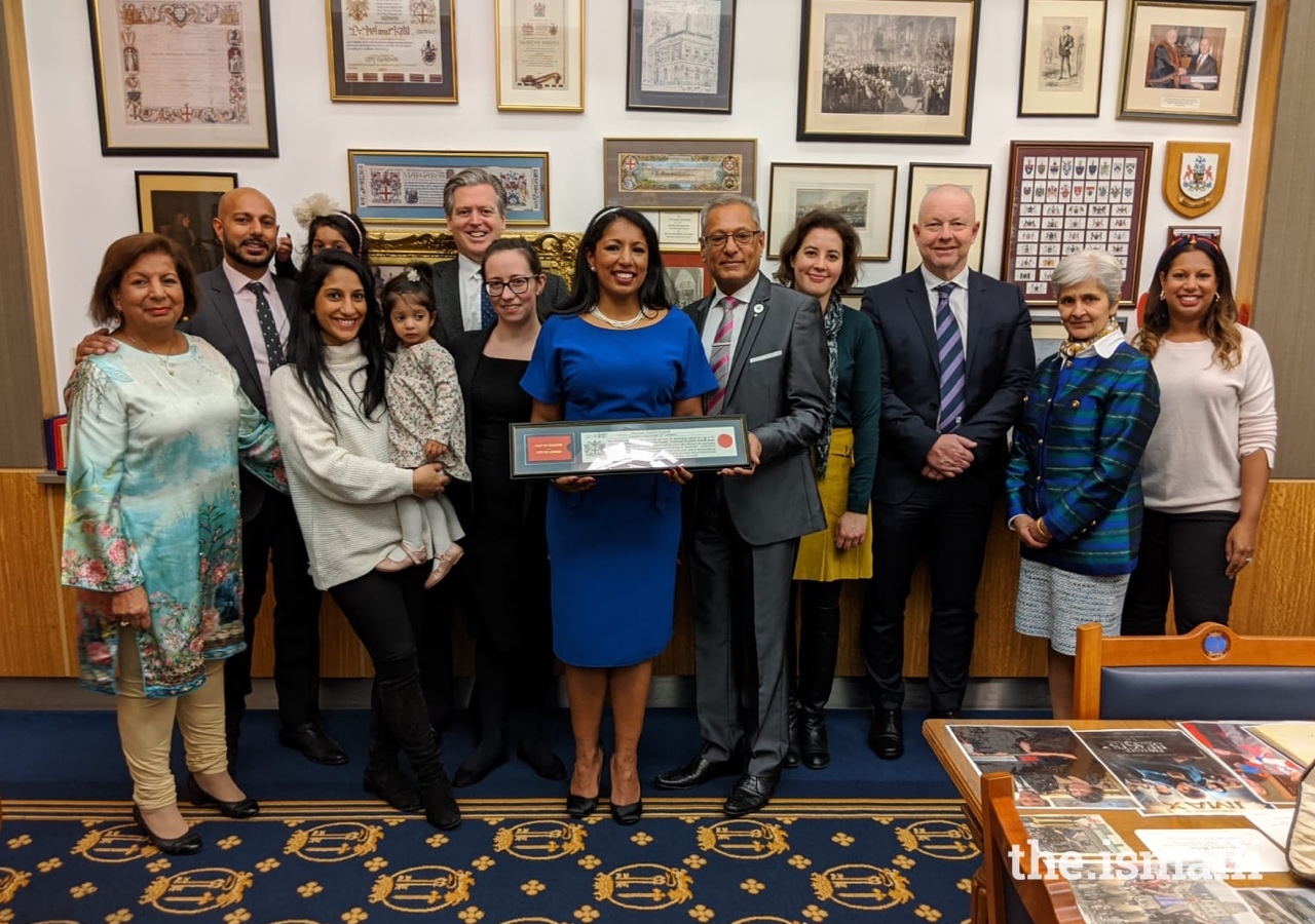 Naureen Karim Shariff joins family, friends, and colleagues for a group photo at the Freedom of the City of London award ceremony at The Guildhall in London.