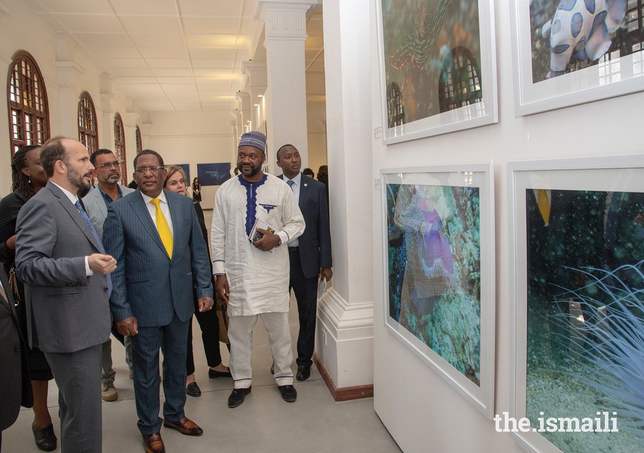 Prince Hussain describes some of the distinguishing features of marine animals exhibited in the collage as Cabinet Secretary Honourable Keriako Tobiko, and panelists David O. Obure, Doreen Robinson and Dr. Cyrille-Lazare Siewe look on with keen interest.
