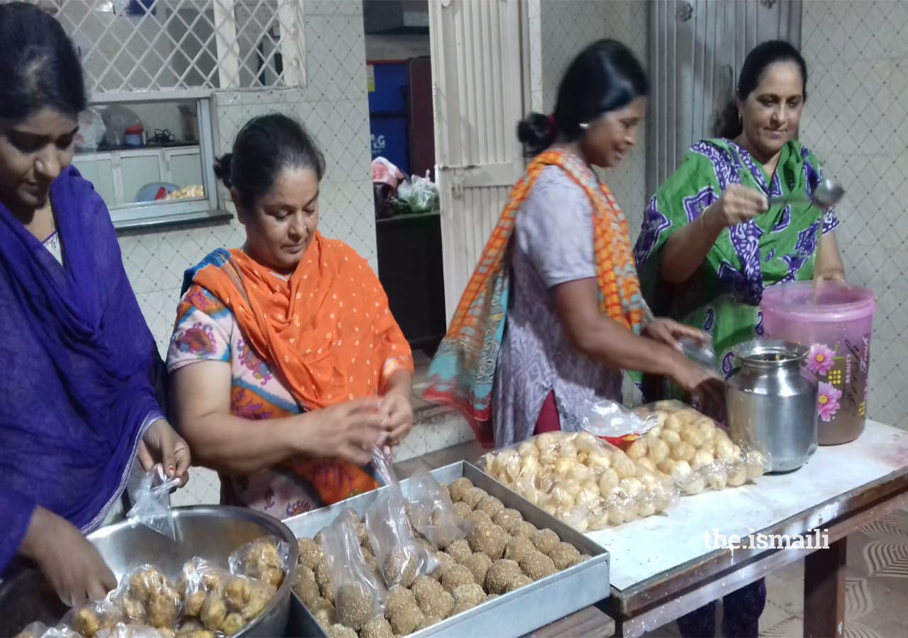 Pait Puja ladies with WAP members at Snack Counter during Youth Sports program in Academy