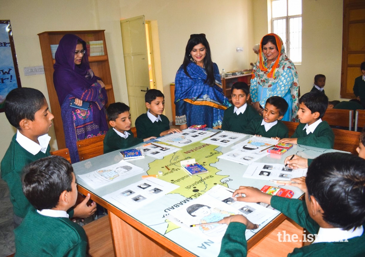 Nasreen Aman in a classroom with the children.