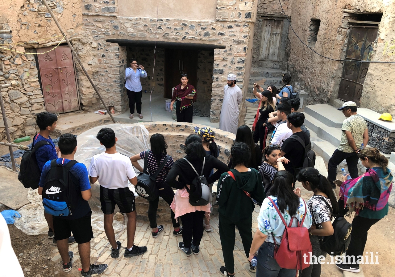 Students gather to learn about conservation and preservation of the Misfat al-Abriyeen settlement.