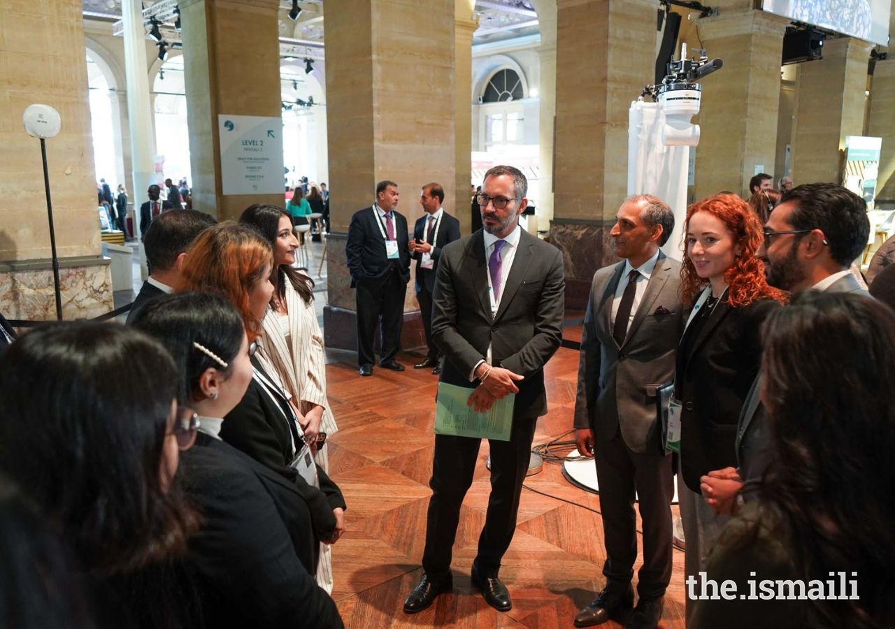 Prince Rahim at the Paris Peace Forum 2022 with volunteers from the community
