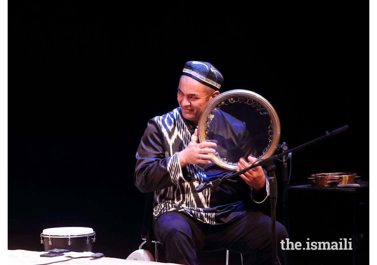 Abbos Kosimov plays the frame drum at the Asia Society Center Texas.