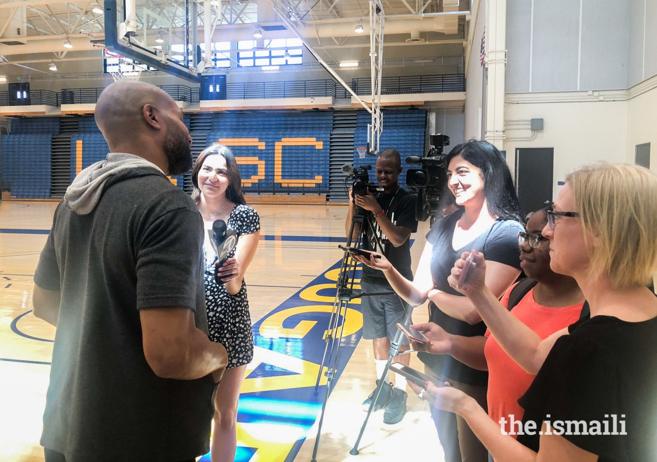 Sabreena Merchant interviewing Sparks head coach and five-time NBA champion with the Lakers, Derek Fisher
