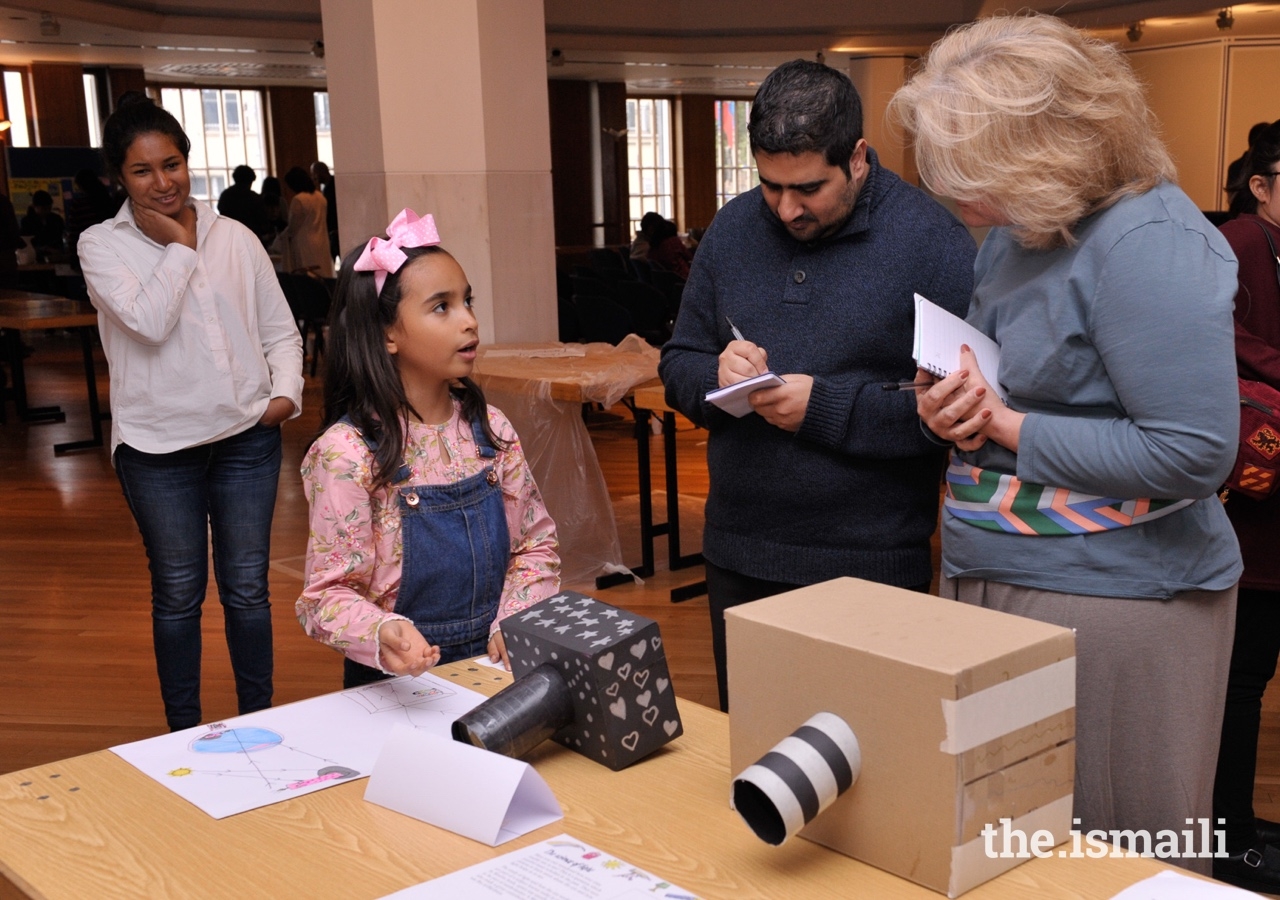 Judges review the science experiments, projects, and inventions entered into the Science Fair competition.