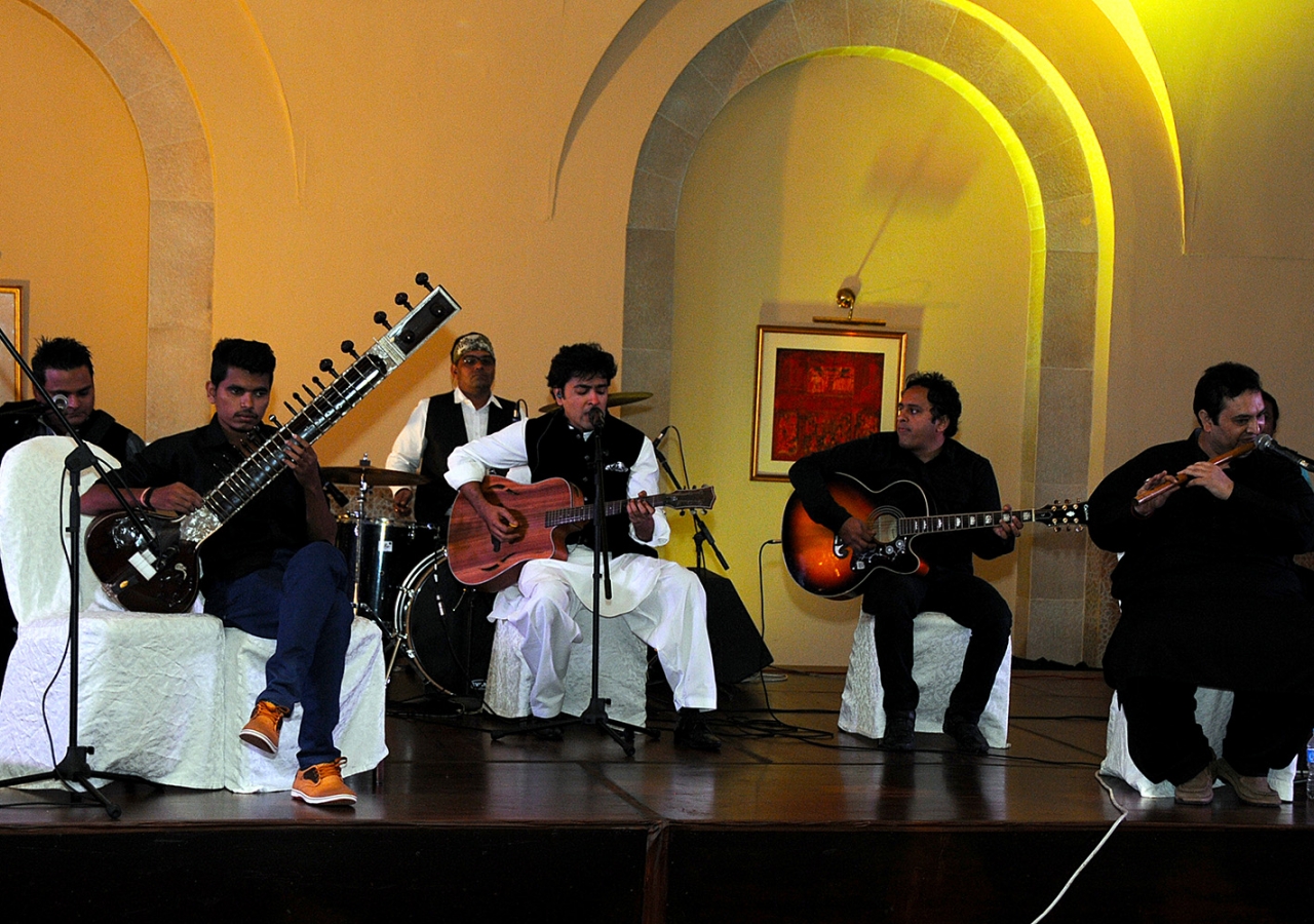 Musicians led by Pakistani-Ismaili singer Shehzad Roy perform before Princess Zahra and Prince Rahim at the institutional dinner. Al-Jalil Ajani