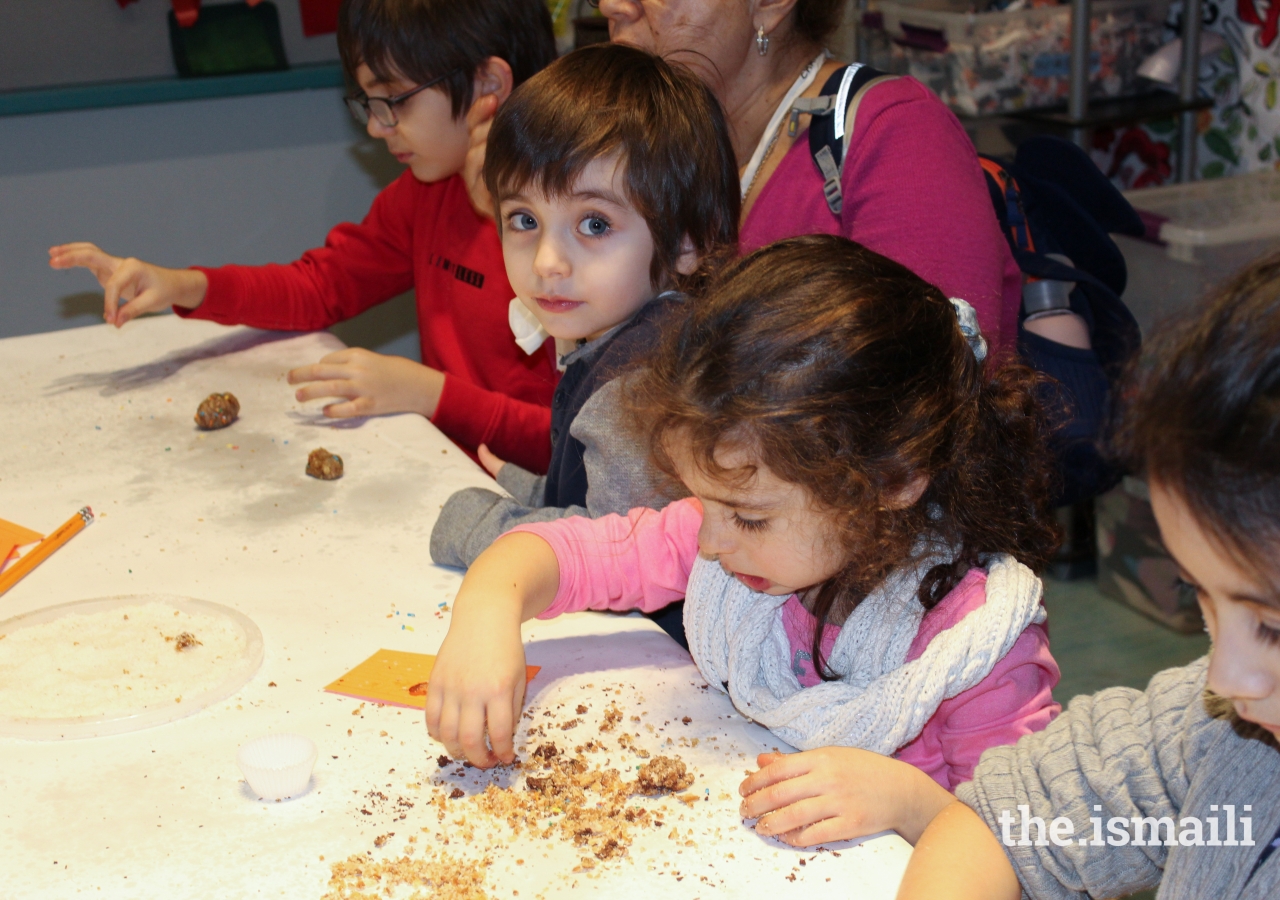 Young museumgoers made delicious Persian date balls.