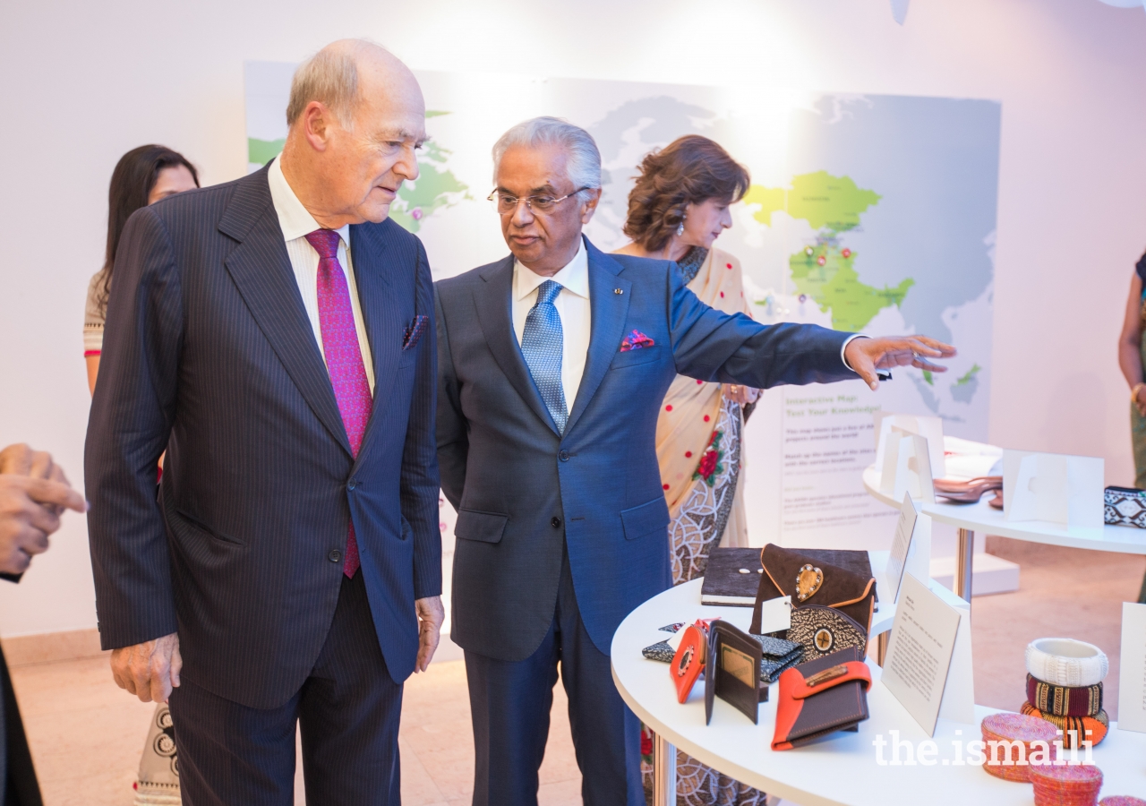 Prince Amyn and Nazim Ahmad observe the artefacts on display at the Ethics in Action exhibition.