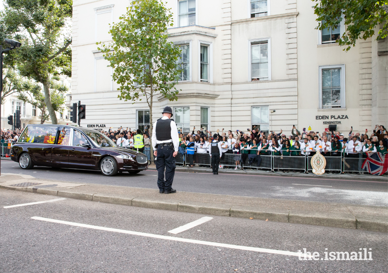 Members of the Ismaili Volunteer Corps lined up near the Ismaili Centre in London's South Kensington to pay their final respects as the hearse drove past.
