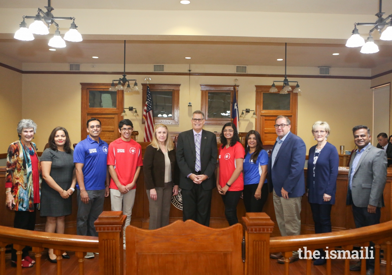 Aga Khan Youth and Sports Board for USA Chairman Sean Hassan along with members of the local Ismaili Council leadership attending the presentation of the Proclamation with the Williamson County elected officials.