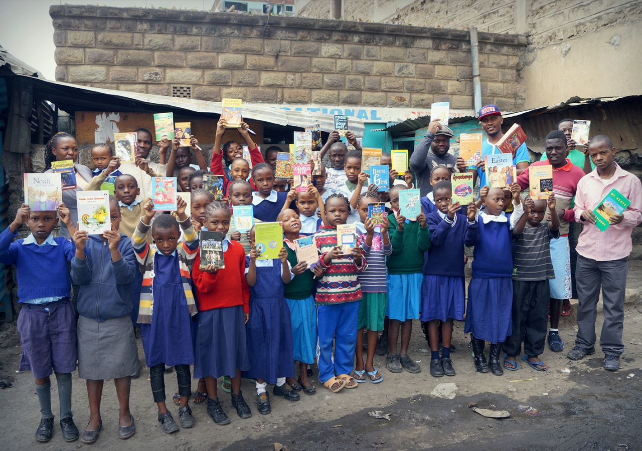 Children at Viara Junior Academy receive books as rewards for their commitment to learning. Courtesy of Bamba