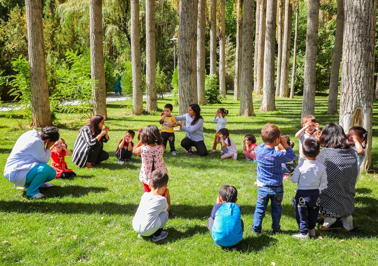 Young learners and their teachers at the Aga Khan Early Childhood Development centre in Khorog, Tajikistan, enjoying a moment of outdoor play.