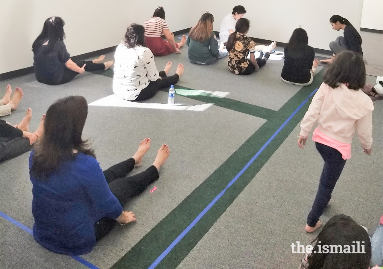Jamati members participate in a yoga & mindfulness session.