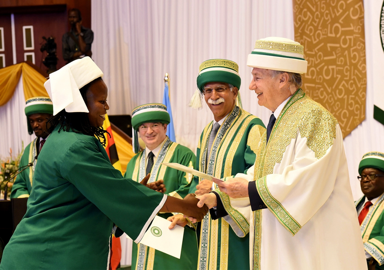 A graduand receives her degree from the Chancellor of the Aga Khan University, at the 2015 convocation ceremony in Kampala. AKDN / Zahur Ramji
