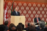 Mawlana Hazar Imam speaks at the opening of the Ismaili Centre, Toronto, as the Canadian Prime Minister looks on. Gary Otte