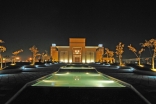 An evening view of the Ismaili Centre, Dushanbe. Pedestrian walkways line the cascading water feature, leading to the building’s Main Entrance.