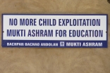 A sign posted at an Ashram run by an Indian NGO that helps child labourers decries child exploitation.
