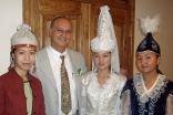 Nasir Jetha with traditional dancers in Kyrgyzstan, where he served as a TKN volunteer at the University of Central Asia.