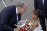 Mawlana Hazar Imam being presented with a bouquet of flowers by seven-year-old Ramla Saleh upon arrival in Nairobi.  