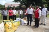 Governor of Gaza Province, Raimundo Diomba, receives a donation of food and cooking utensils for flood victims in Chibuto District, delivered by representatives of the AKDN and the Ismaili community.