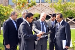 Prince Amyn inspects plans at the Centro Ismaili in Lisbon with President Amirali Bhanji of the Ismaili Council for Portugal, Rahim Kara, the Centro Ismaili building manager and other senior management.    