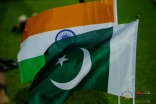 The flags of India and Pakistan wave in the breeze in the early hours of the morning. JG/Mairaj Amir