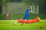 Team India (red) tries to save a boundary hit by Team Pakistan (blue). JG/Mairaj Manji