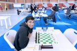 Danial Asaria at a chess tournament.