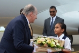 Upon arriving in Nairobi, Mawlana Hazar Imam is presented with a bouquet of flowers by Umaiza Jamal, a young member of the Ismaili Volunteer Corps.