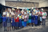 Children at Viara Junior Academy receive books as rewards for their commitment to learning. Courtesy of Bamba