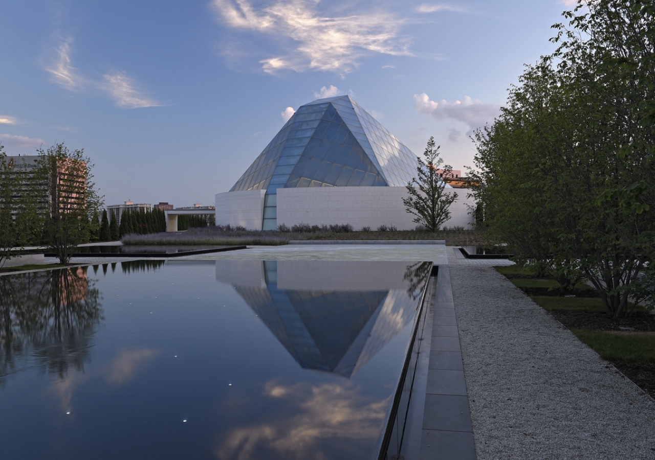 Charles Correa has revisited and reinterpreted the traditional notions of a dome by playing with light, colour and symmetry to give the Ismaili Centre a unique glass crystalline dome. Gary Otte
