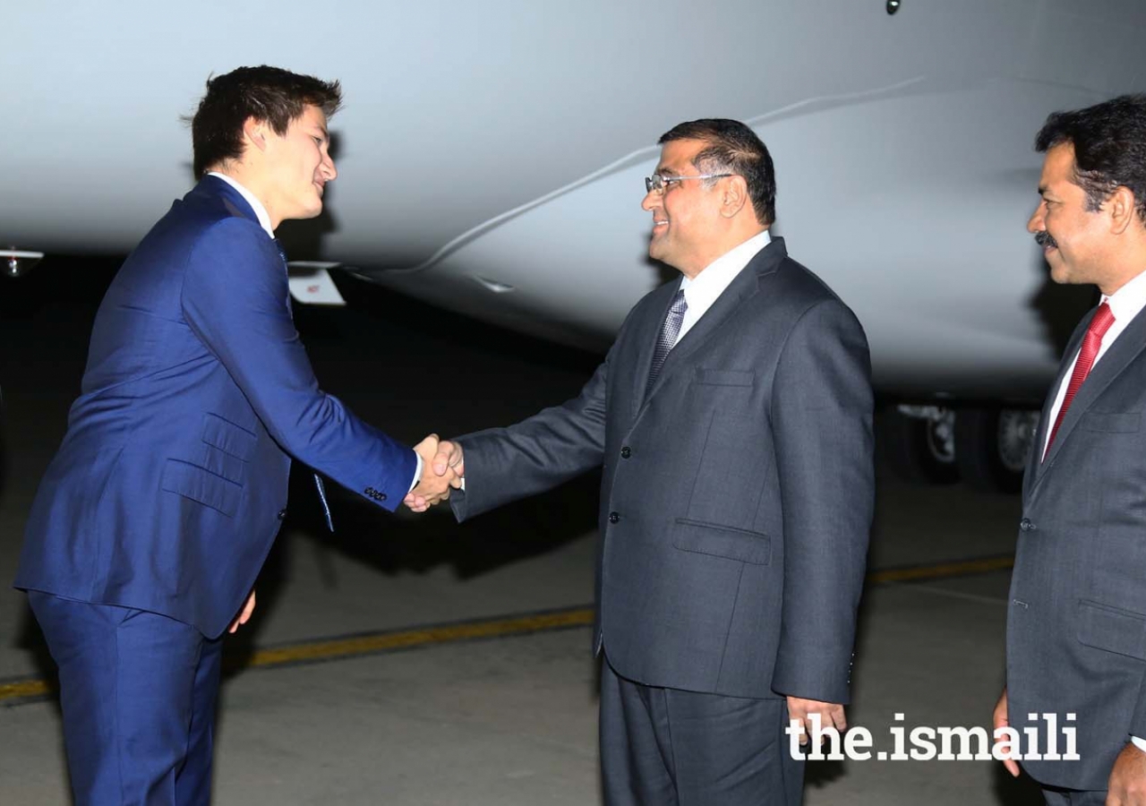 Prince Aly Muhammad is greeted by Hafiz Sherali, President of the Ismaili Council for Pakistan, at Islamabad Airport.