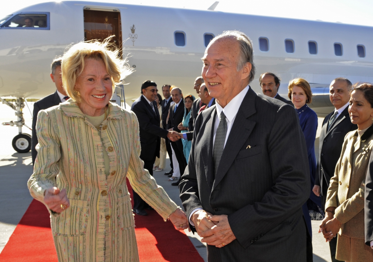 Mawlana Hazar Imam is accompanied by Charlotte Schultz, Chief of Protocol from the office of the Governor of California after disembarking in Los Angeles, California.  