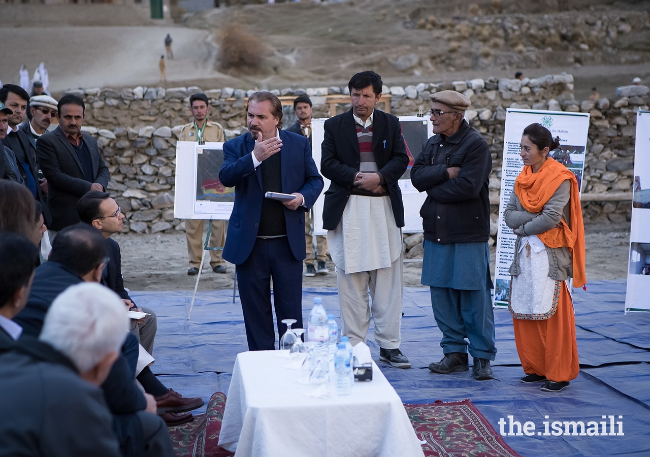 Prince Rahim and Princess Salwa receive a briefing from community leaders and management of the Aga Khan Agency for Habitat (AKAH) in the village of Bilhanz located in Immit, Ishkoman Valley, Ghizer District in Gilgit-Baltistan. In July 2018, unusually warm weather precipitated intensified melting of snow and glaciers which resulted in a large glacial lake outburst flood (GLOF) which submerged farmland and destroyed houses in Badswat and Bilhanz villages.