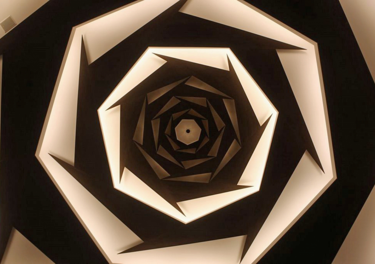 The ceiling light feature in the Prayer Hall consists of seven heptagonal (seven-sided) figures, visible in this close-up. 