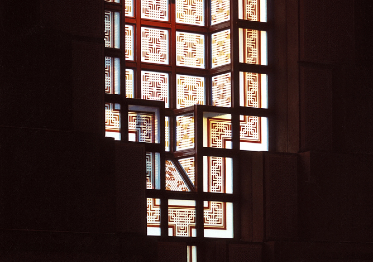 The opalescent cast-glass windows in the Prayer Hall are decorated with stained geometric patterns.