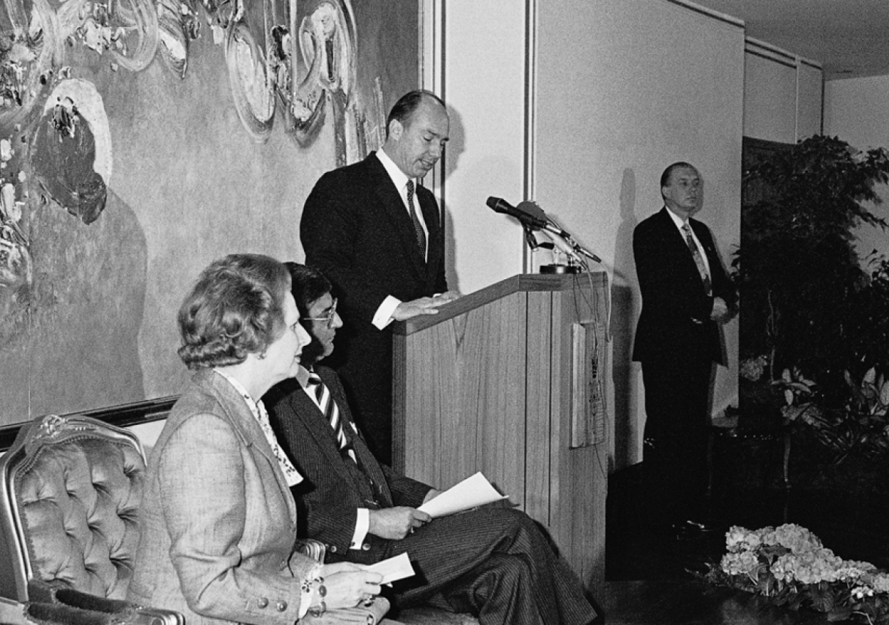 Mawlana Hazar Imam addresses the audience at the Opening Ceremony of the Ismaili Centre, London, as Prime Minister Margaret Thatcher and Ismaili Council President Anil Ishani look on.