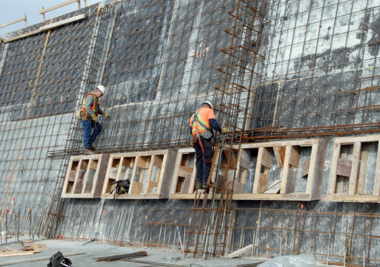 May 2011: Construction workers inspect reinforcing steel and window frames before concrete is poured in the walls of the Aga Khan Museum.