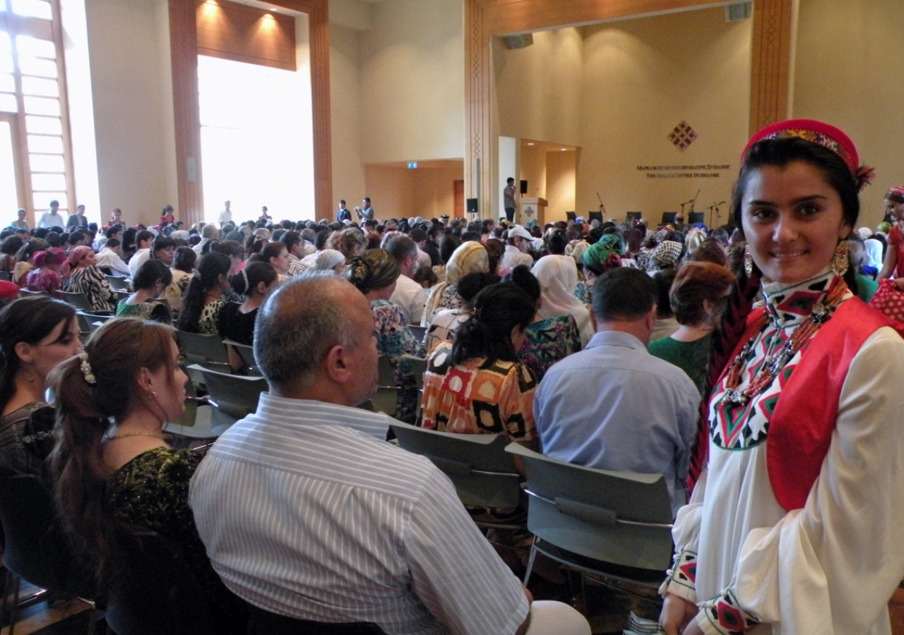 A volunteer celebrating Eid ul-Fitr with the rest of the Jamat in the auditorium of the Ismaili Centre, Dushanbe.