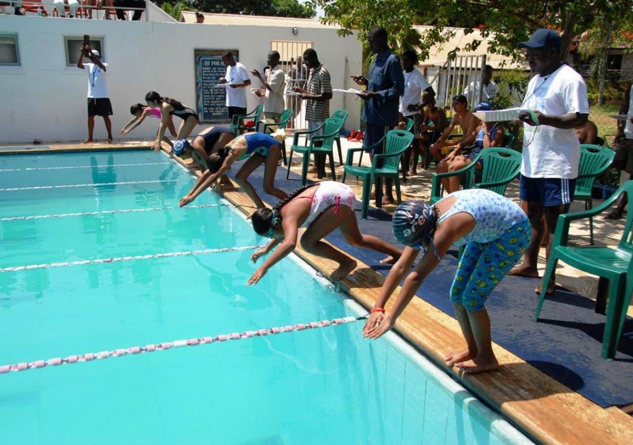 Young participants starting a swimming competition.     