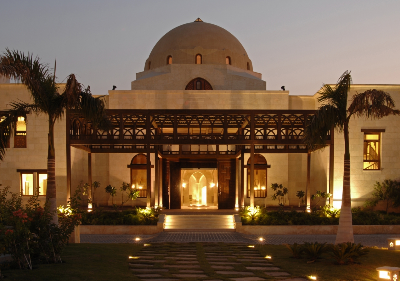 The entrance of the Ismaili Centre, Dubai is adorned by fountains, trees and a five-arched teak and meranti portico.