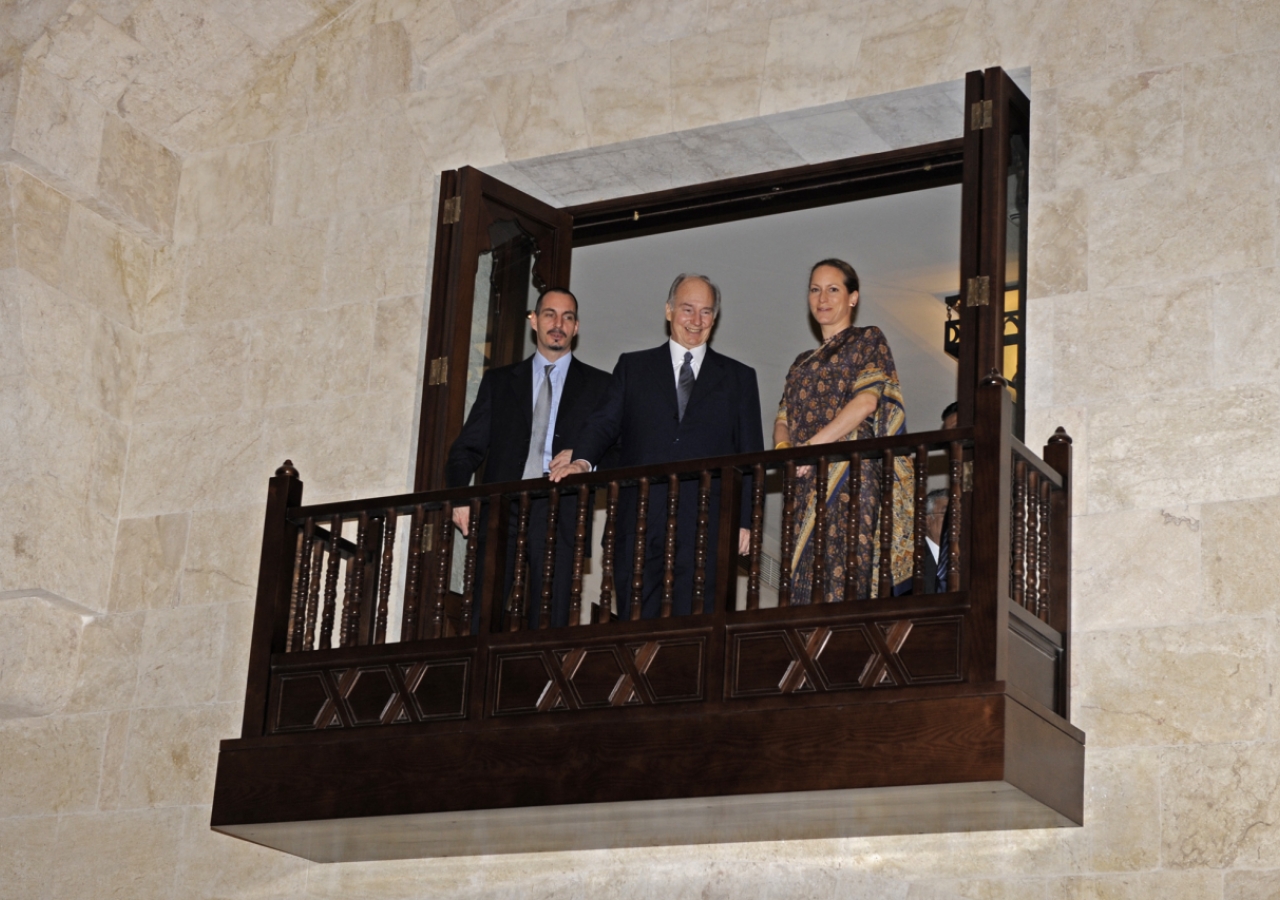 Mawlana Hazar Imam together with Prince Rahim and Princess Zahra overlooking the entrance hall of the Ismaili Centre Dubai from the balcony above. 
