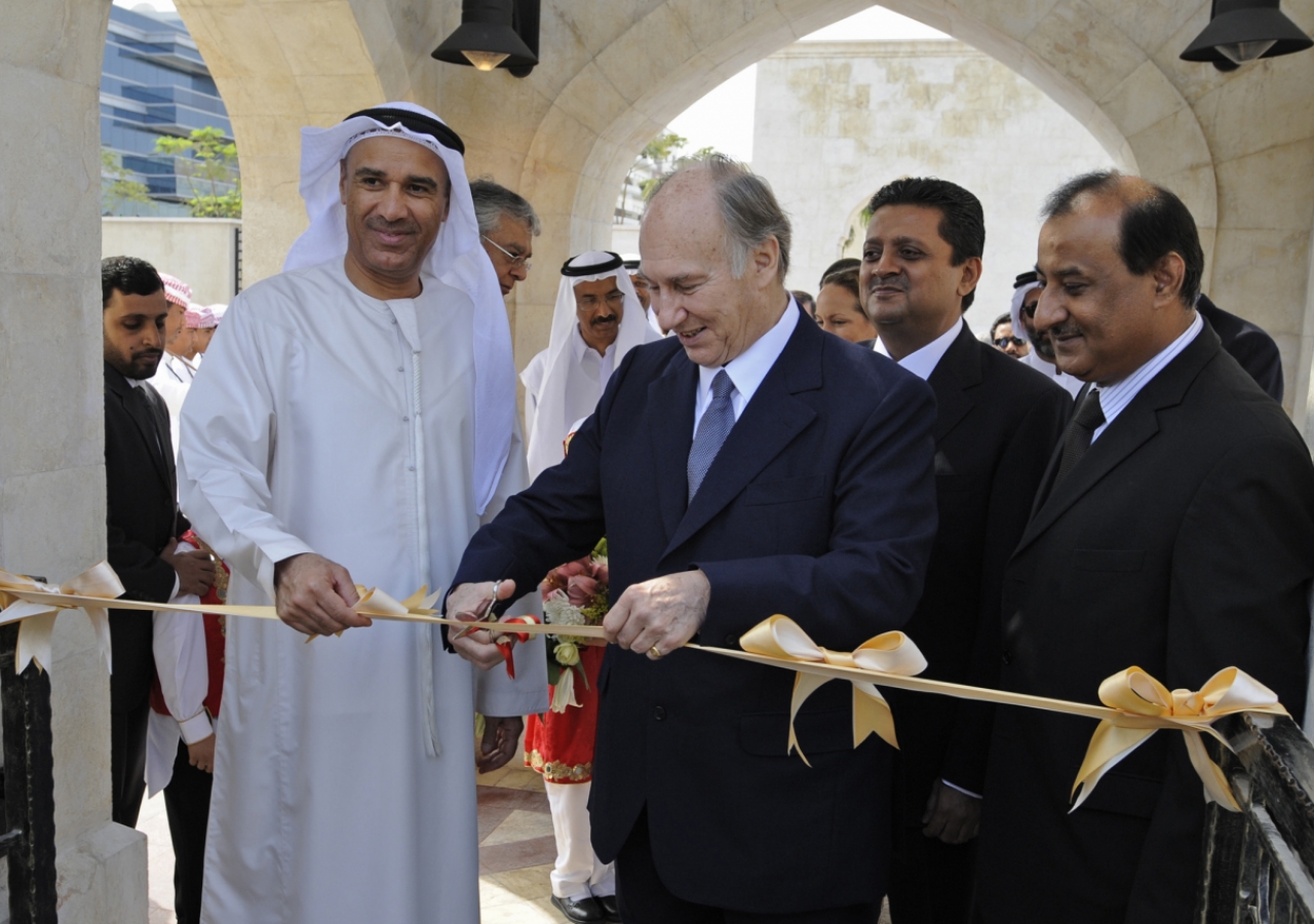 Mawlana Hazar Imam is joined by Hussain Nasir Lootah, Acting Director General of Dubai Municipality, for the ribbon-cutting ceremony inaugurating the Dubai Park. Leaders of the UAE Jamat look on.  