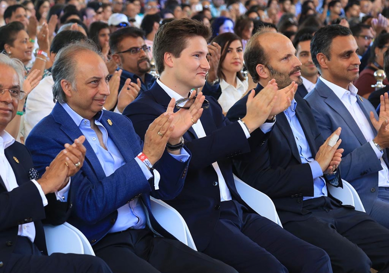 Prince Hussain and Prince Aly Muhammad enjoy an International Talent Showcase performance at Portugal Pavillion Canopy, during the Diamond Jubilee Celebration.