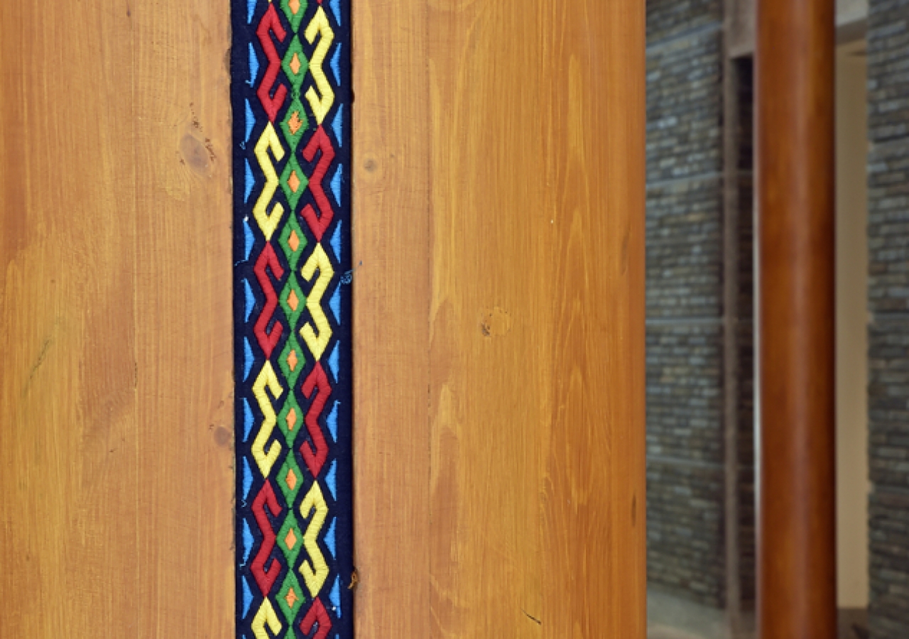 Inlaid fabric pattern on wood columns at the Ismaili Jamatkhana and Centre, Khorog.