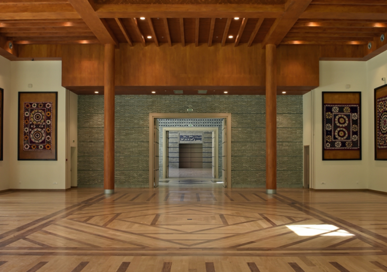 The social hall of the Ismaili Jamatkhana and Centre, with a wooden floor, reflecting the pattern of its traditional Pamiri roof.